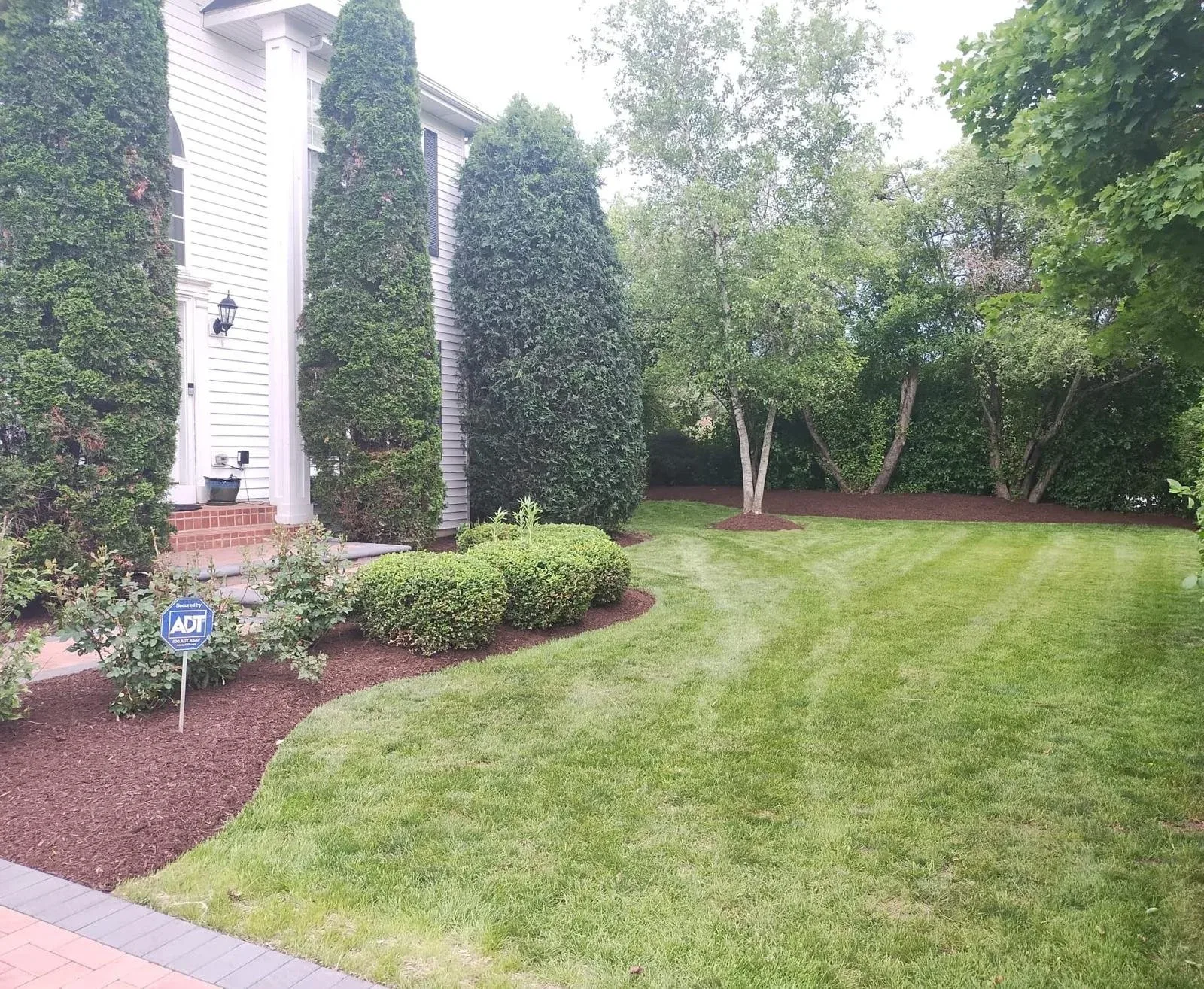Planting beds and finished lawn by Panther Landscape in northern Illinois and southern Wisconsin